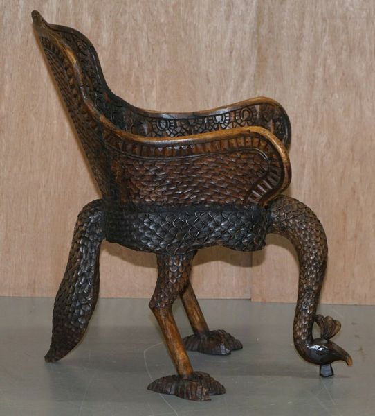 Pair of ornate burmese anglo indian hand carved circa 1880 peacock armchairs – A rare vintage treasure