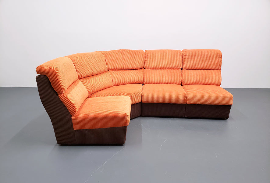 Mid century modular corner sofa in rusty orange corduroy – A rare vintage treasure