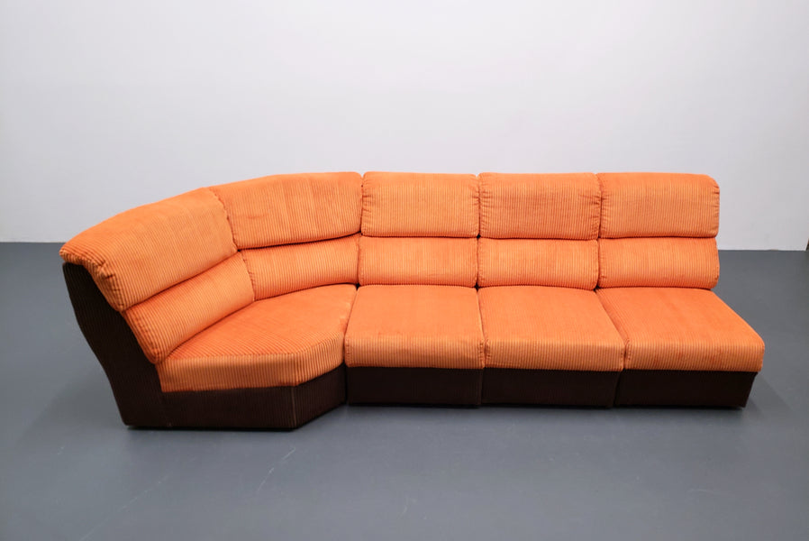 Mid century modular corner sofa in rusty orange corduroy – A rare vintage treasure