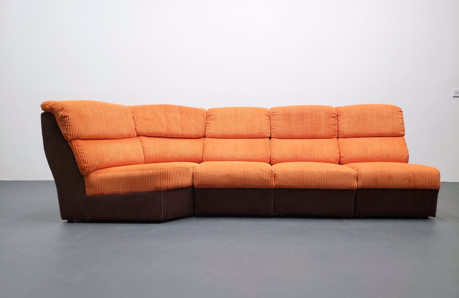 Mid century modular corner sofa in rusty orange corduroy – A rare vintage treasure