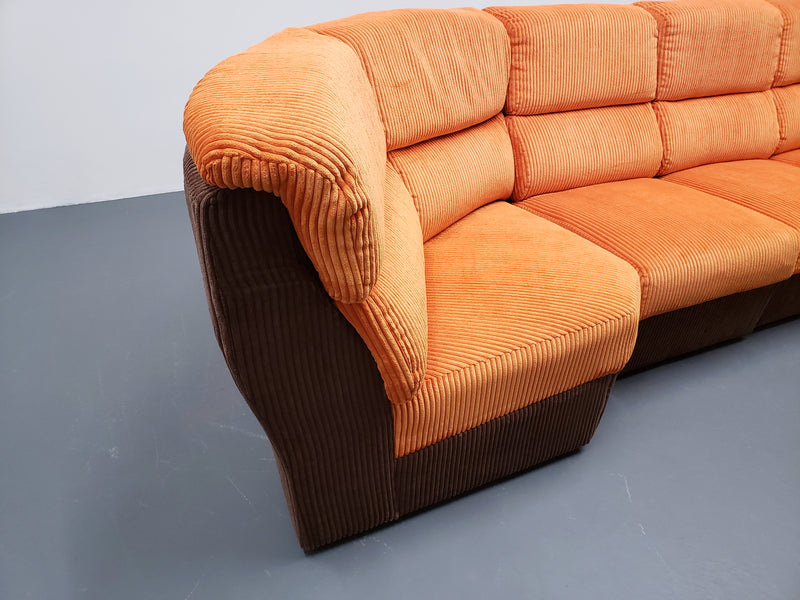 Mid century modular corner sofa in rusty orange corduroy – A rare vintage treasure