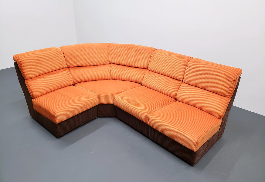 Mid century modular corner sofa in rusty orange corduroy – A rare vintage treasure